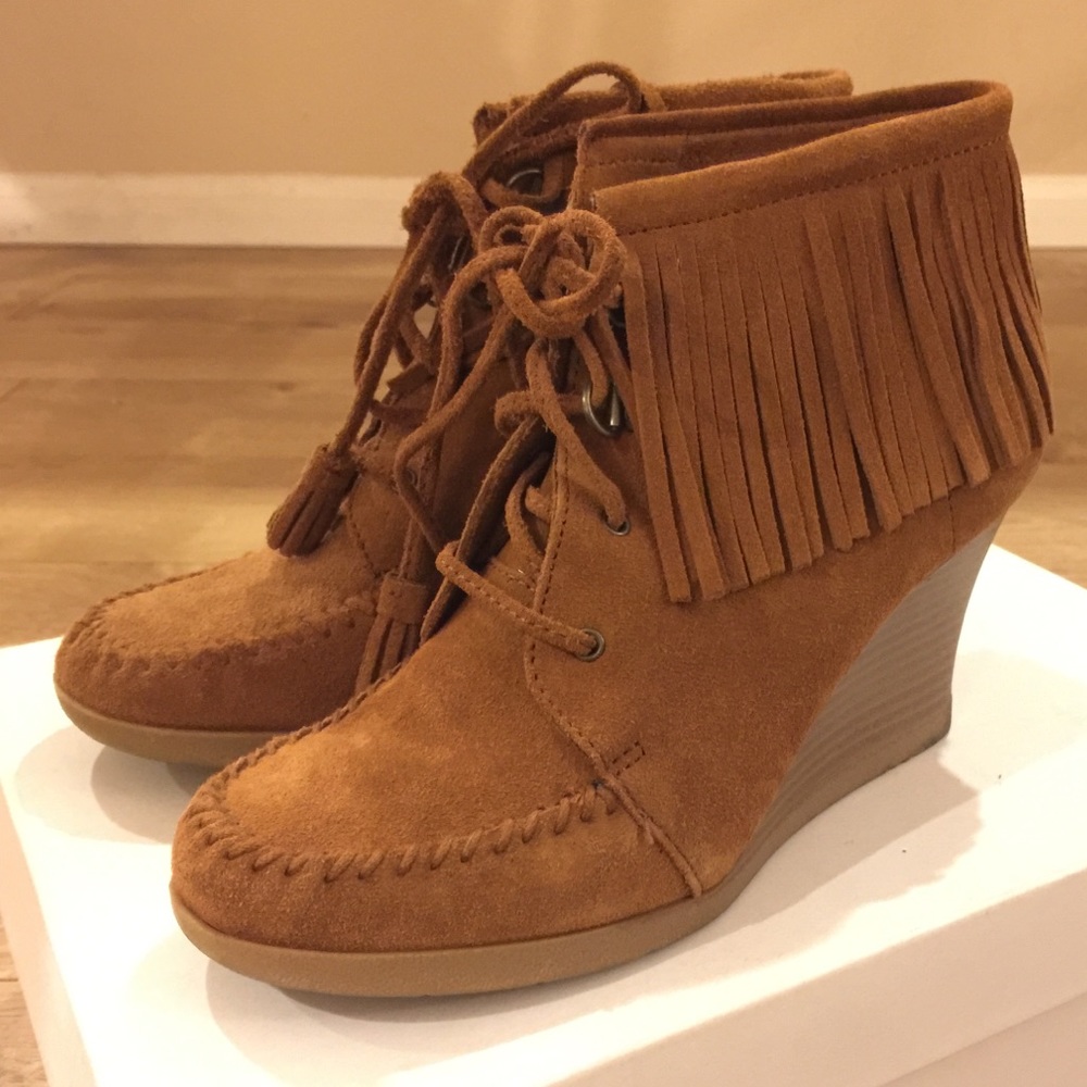 Minnetonka fringe ankle wedge boots